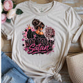 Sand colored t-shirt with graphic of a girl with messy bun and sunglasses, cross, leopard print heart, and bold text reading Not Today Satan with Nope Not Ever